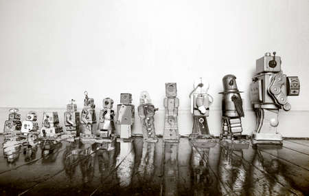 a line of vintage robots from small to big in solarized monochromeの写真素材