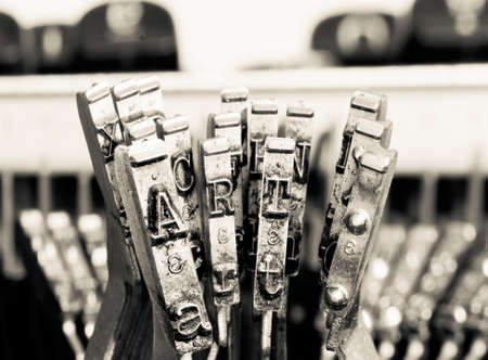 the word ART  with old typewriter hammers  in monochromeの写真素材