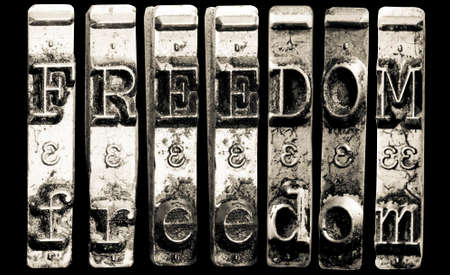 the word FREEDOME with old typewriter hammersの写真素材