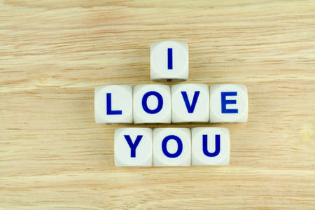 Alphabet Blocks I LOVE YOU on Wooden Surface Backgroundの写真素材