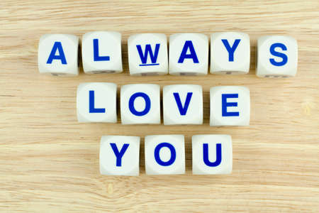 Alphabet Blocks ALWAYS LOVE YOU on Wooden Surface Backgroundの写真素材