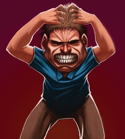 A guy grabbing his hair with angryの写真素材