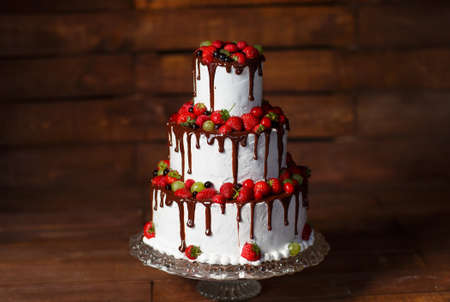 Strawberry cake on a wooden background.の写真素材
