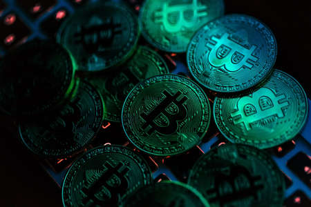 Bitcoin coins on laptop keyboard. Cryptocurrency concept.の写真素材