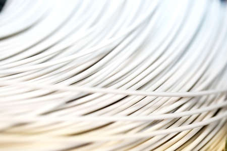 close up a roll of white cable as a backgroundの写真素材