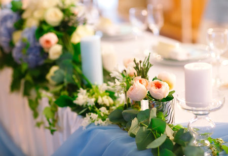 Wedding table settings. Empty plates and glasses on a white tablecloth.の写真素材