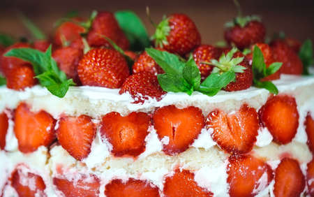 Strawberry cake as sweet treat and dessert on a wooden background.の写真素材