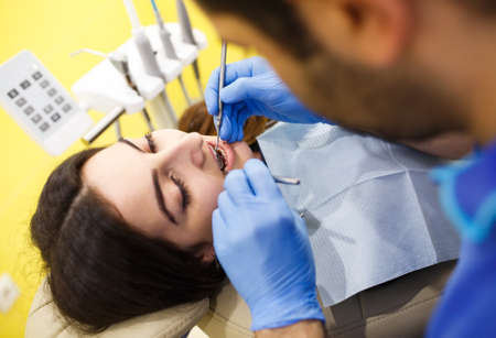 The patient caring for teeth in the dental clinicの写真素材