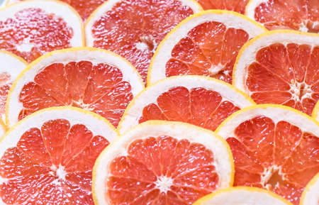 Close up of sliced grapefruit as a backgroundの写真素材