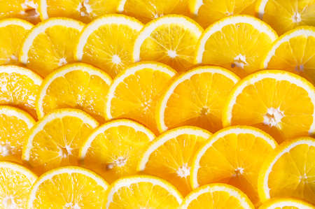 Background of orange ripe sweet slicesの写真素材