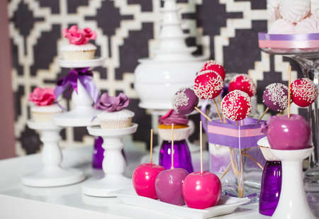 Candy bar. Table with sweets on the wedding day.の写真素材