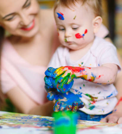 Mom and Daughter paint on canvas at the drawing schoolの写真素材
