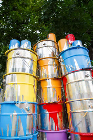 The used paint cans. Colorful paint bucketsの写真素材
