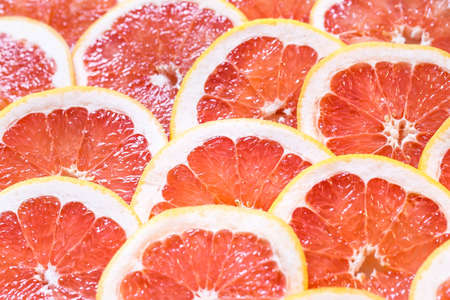 Close up of sliced grapefruit as a backgroundの写真素材