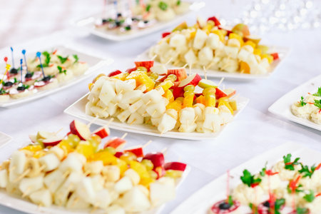 fruit canapes from banana, grape, orange and apple