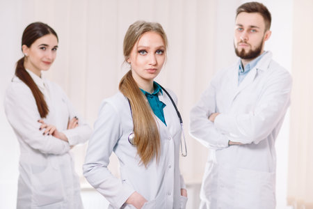 Portrait of doctors in white coats in the hospital ward