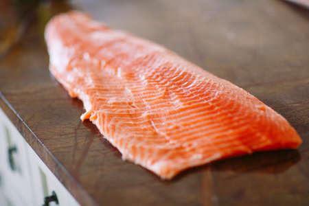 Fish Salmon on the cooking table of a cookの写真素材