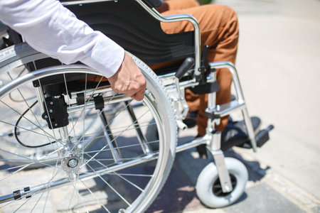 A young man in a wheelchair who can not descend the stairs.
