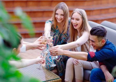 Celebration. People holding glasses of champagne making a toast.