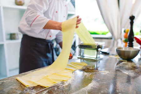 The chef prepares the paste for the visitors.の写真素材