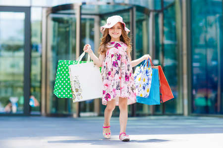 Cute little girl on shopping. Portrait of a kid with shopping bags. Shopping. girl.の写真素材