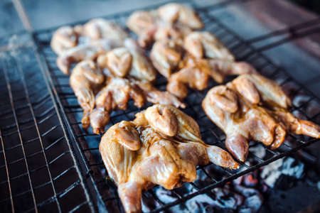 Quails on the grill. Chicken meat on the grill.の写真素材