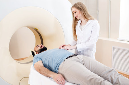Happy patient undergoing mri scan at hospital.
