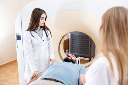 Happy patient undergoing mri scan at hospital.