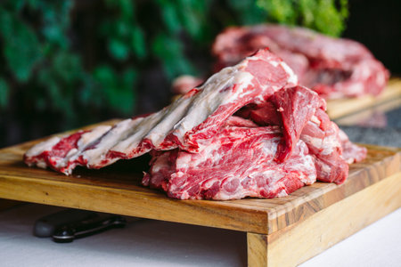 A large piece of meat on a stone table