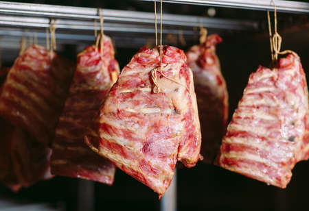 Smoking ribs in an oven. Sausage production in the factory.の写真素材