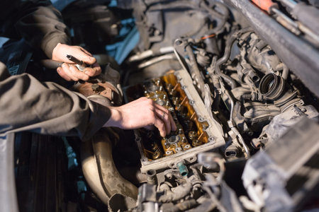 Auto mechanic working in garage. Repair service