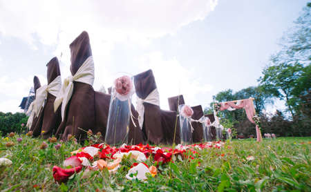 Wedding ceremony decorations. White and brown tones of wedding details.の写真素材