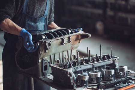 Master collects a rebuilt motor for the car