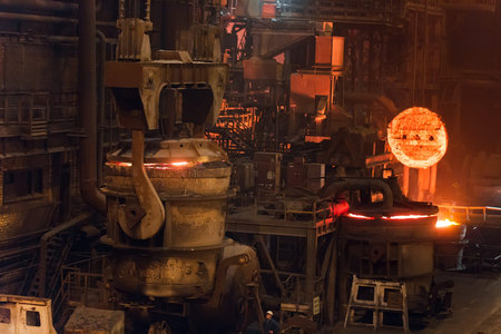 Melting of metal in a steel plant. High temperature in the melting furnace. Metallurgical industry....