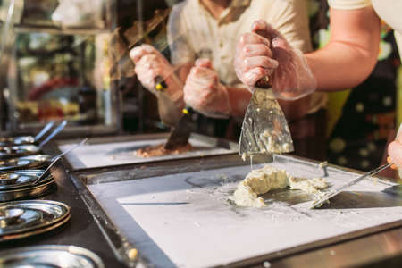 stir-fried ice cream rolls at freeze pan. Organic, natural rolled ice cream, hand made dessertの写真素材