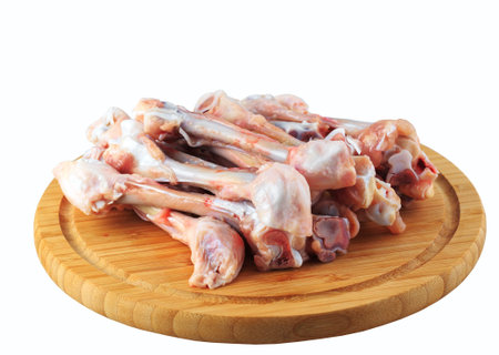 raw chicken bones on a white background