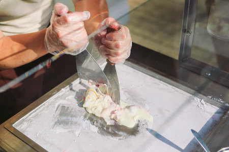 stir-fried ice cream rolls at freeze pan. Organic, natural rolled ice cream, hand made dessert.