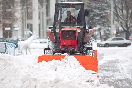Snow machine cleans the snow in the city.