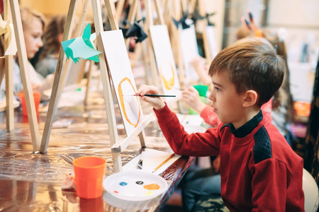 group lesson in drawing. Children learn to draw in the classroom