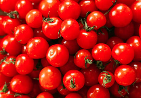 Cherry tomatoes in a transparent deep plate.の写真素材