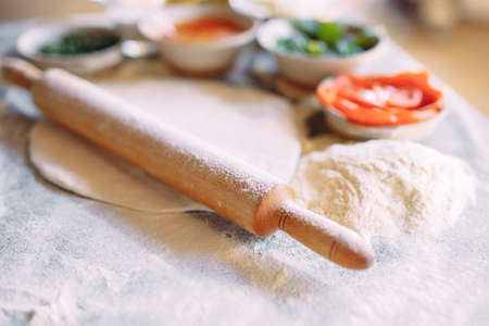 Cooking Pizza. Pizza ingredients on the table.の写真素材