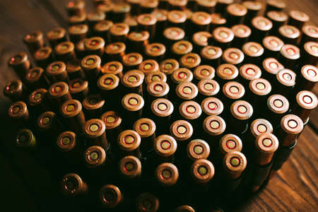 Bullets on a wooden background. Military concept.の写真素材