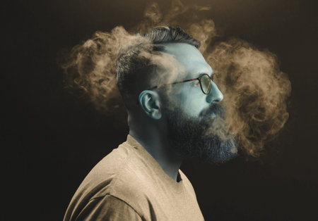 Concept. Smoke enveloped the head man. Portrait of a Bearded, stylish man with smoke. Secondhand...