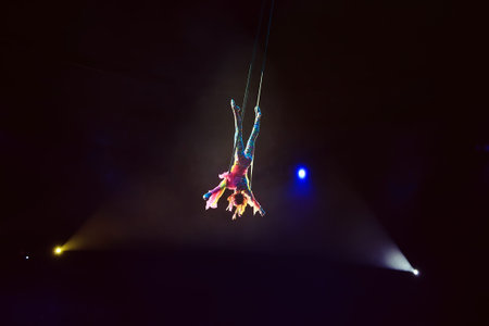 Performance of the girl aerial acrobat in the circus.