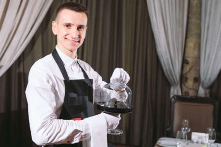 restaurant chef delicacy. truffle vegan food mushroom. waiter service meal conceptの写真素材