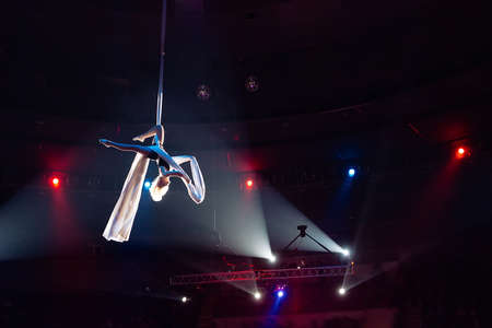 Girls aerial acrobatics in the Circus ring.の写真素材