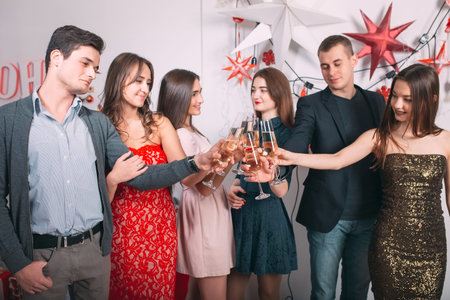 Portrait of several friends celebrating Christmas and New Year.