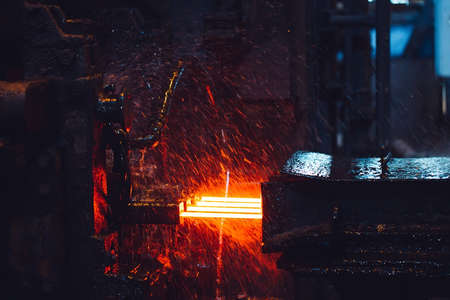 hot steel on conveyor in a steel millの写真素材