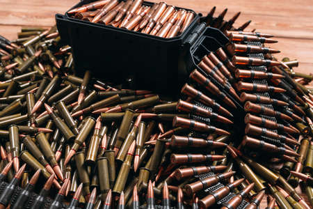 A lot of different ammo on a wooden background.の写真素材