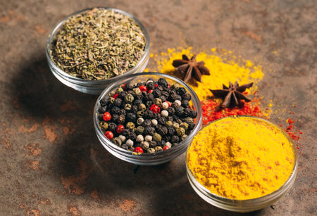 The Different Spices. Spices on stone background.